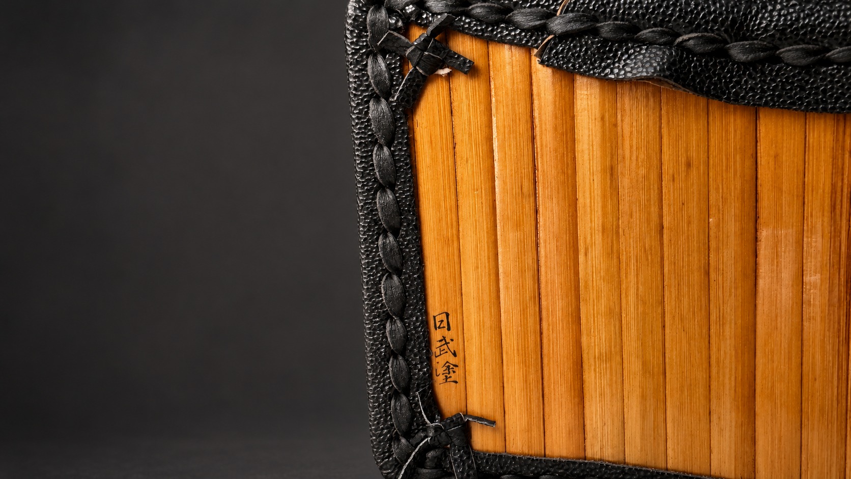 Bamboo do interior with leather stitching and maker inscription